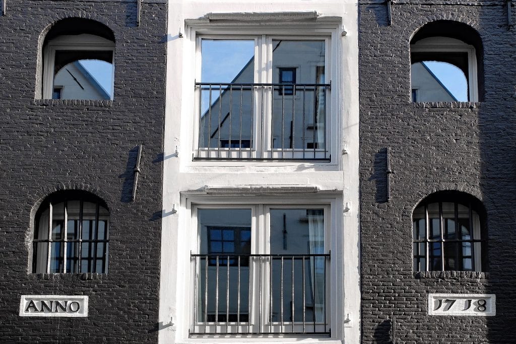 painted brick exterior, black facade